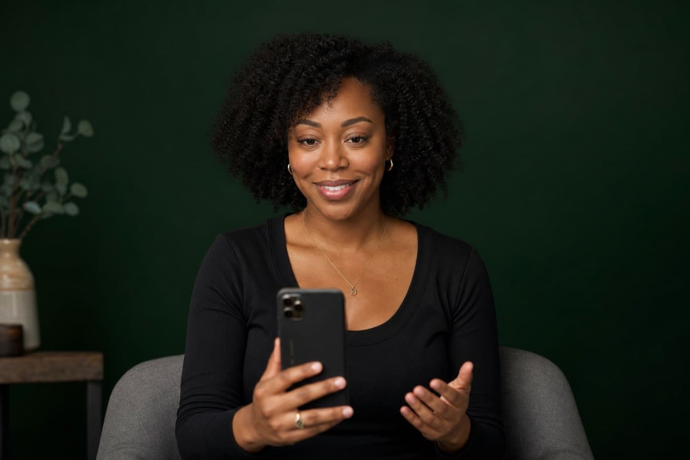 Patient on a telehealth video call, forest green studio portrait style